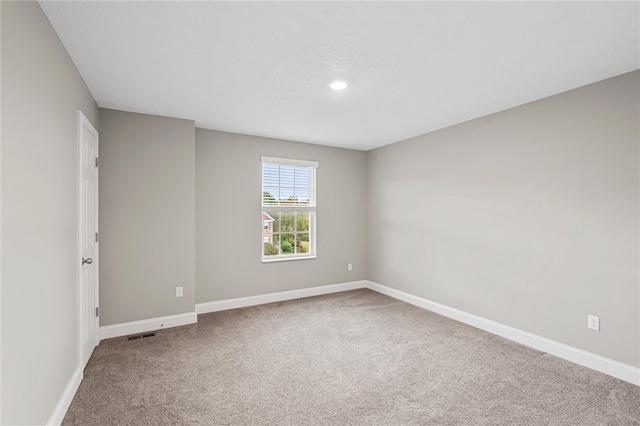 unfurnished room with carpet