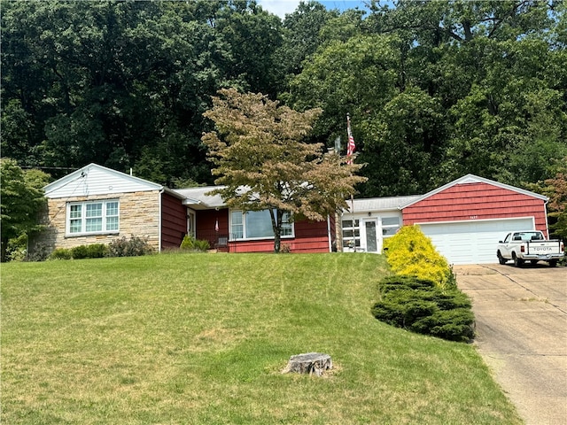 single story home with a front lawn and a garage