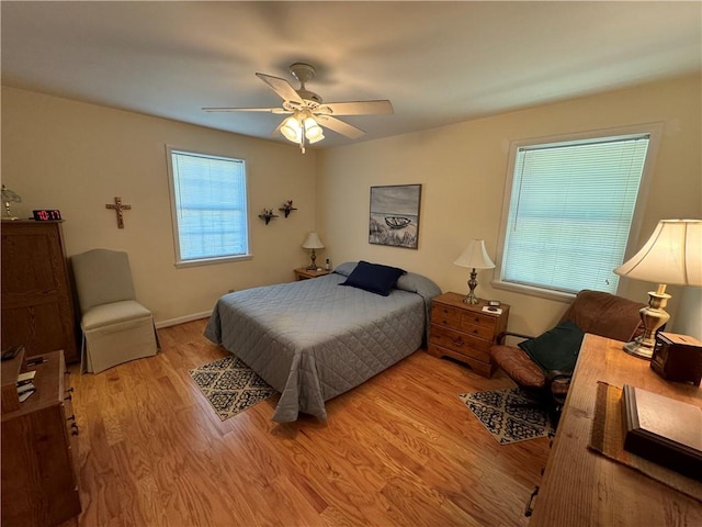 bedroom featuring light wood-style flooring and a ceiling fan