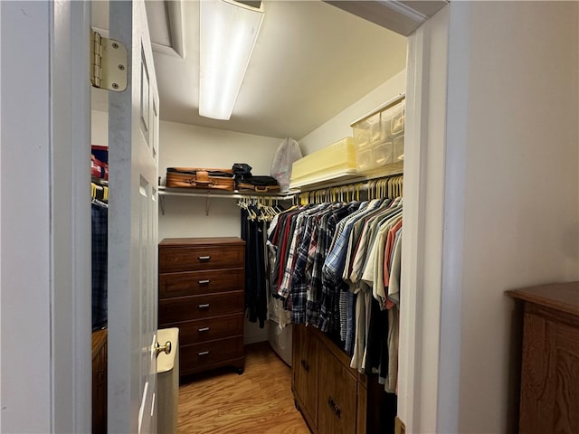 spacious closet featuring light hardwood / wood-style floors