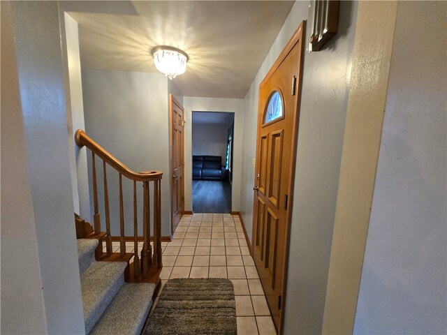 hallway featuring light tile patterned floors