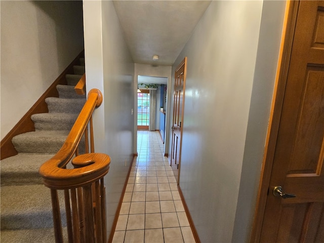 corridor featuring light tile patterned floors