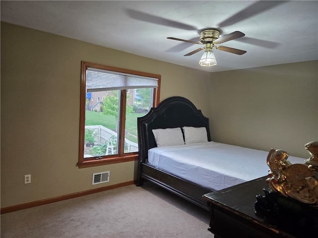 bedroom featuring ceiling fan and light colored carpet