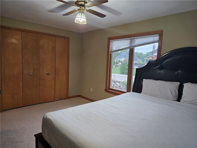 bedroom with ceiling fan and light colored carpet