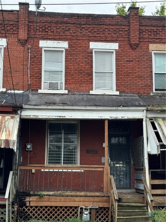 townhome / multi-family property with covered porch