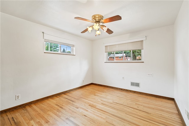 empty room featuring ceiling fan and light wood-type flooring