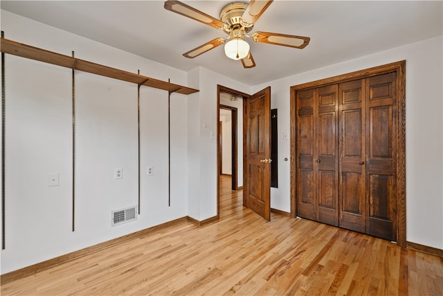 unfurnished bedroom featuring light hardwood / wood-style flooring and ceiling fan