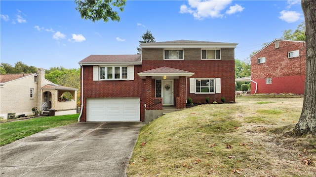 view of front of property with a front lawn and a garage