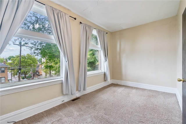 empty room featuring carpet floors