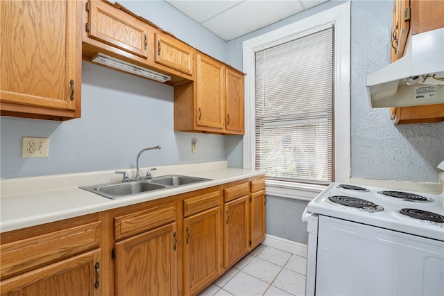 kitchen featuring electric stove, light tile patterned floors, sink, and extractor fan