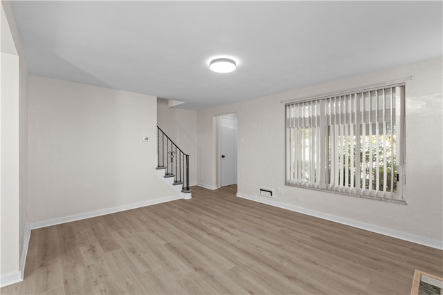 empty room featuring light hardwood / wood-style floors