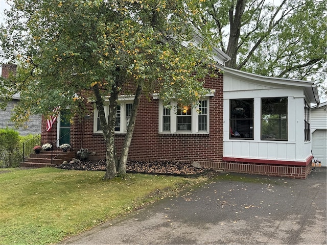 view of property exterior with a yard