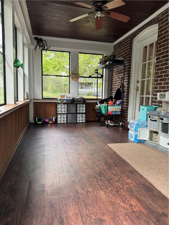 unfurnished sunroom with ceiling fan and wood ceiling