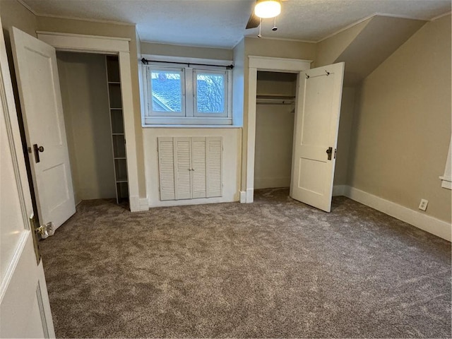 unfurnished bedroom with carpet flooring, ceiling fan, and a textured ceiling