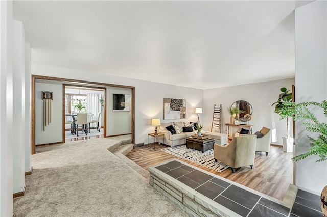 living room with an inviting chandelier and hardwood / wood-style floors