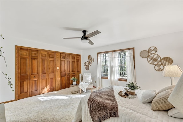 carpeted bedroom with ceiling fan