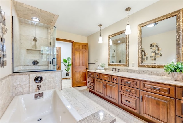 bathroom featuring vanity, plus walk in shower, and tile patterned flooring