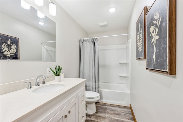 full bathroom with shower / tub combo, wood-type flooring, vanity, and toilet