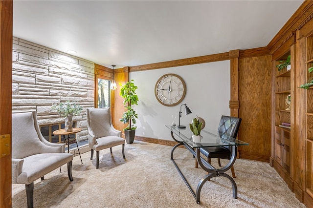 carpeted home office featuring wood walls