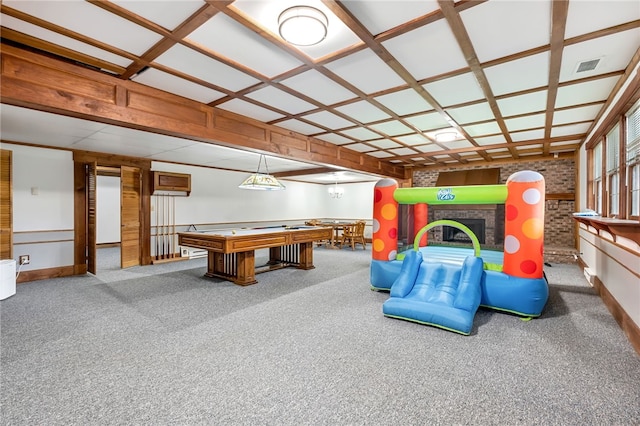 playroom featuring a brick fireplace, carpet floors, and coffered ceiling