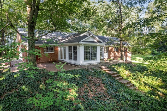 rear view of property with a patio