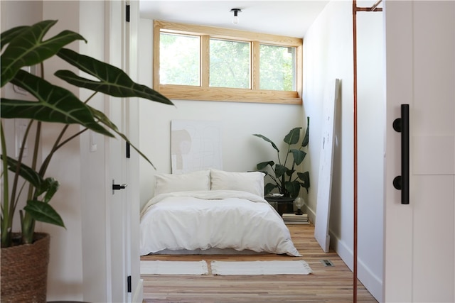 bedroom with light hardwood / wood-style flooring