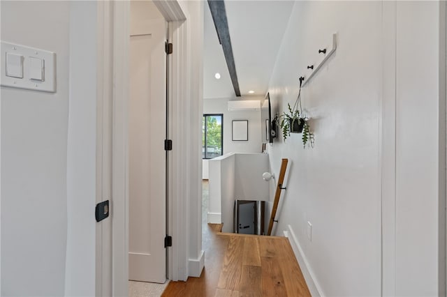 hall featuring light hardwood / wood-style floors and a wall mounted AC