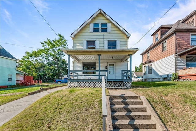 view of front of property featuring a front yard and a porch