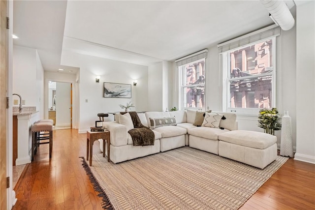 306 4th Ave Unit 501, Downtown Pgh, PA 15222 - living area featuring light wood-style flooring and baseboards