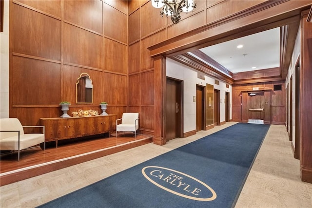 306 4th Ave Unit 501, Downtown Pgh, PA 15222 - lobby featuring crown molding, a decorative wall, and wood walls