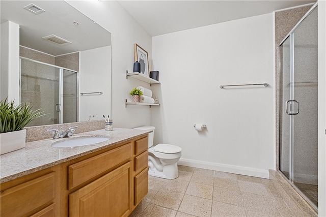 bathroom with a shower with door, vanity, and toilet