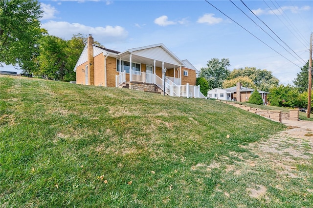 view of front of property with a front lawn and a porch