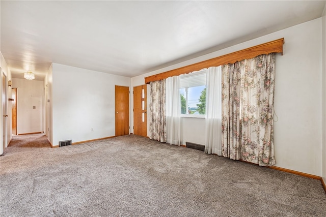 empty room featuring carpet flooring