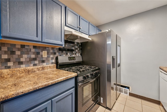 kitchen featuring stainless steel range with gas cooktop, blue cabinets, light tile patterned floors, and tasteful backsplash