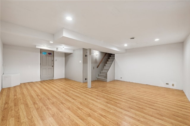 basement featuring light hardwood / wood-style floors