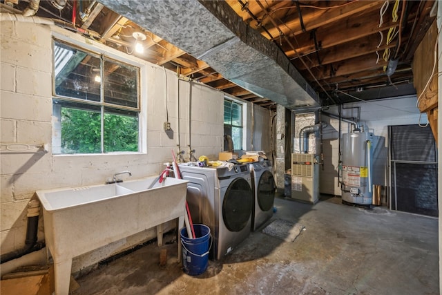 basement featuring separate washer and dryer, gas water heater, and a wealth of natural light