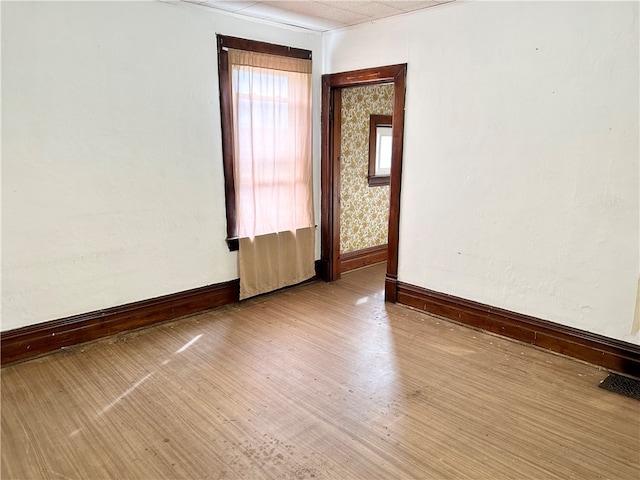 unfurnished room featuring wood-type flooring