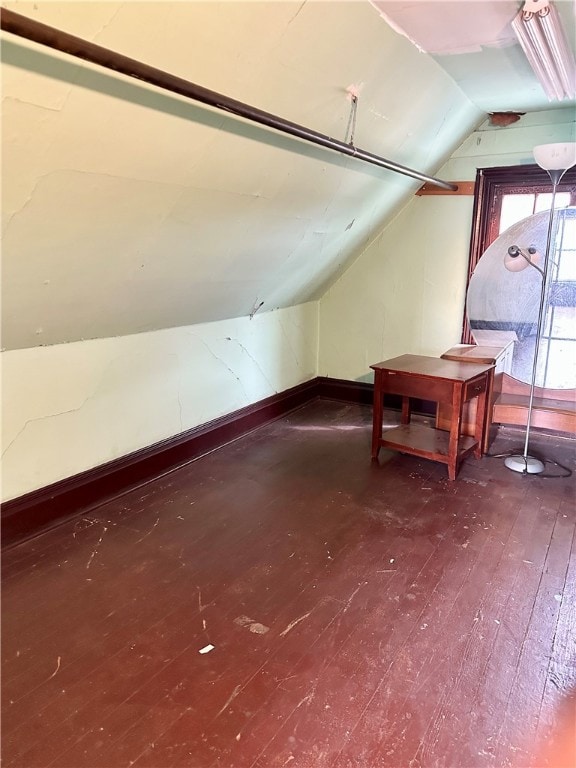 bonus room featuring vaulted ceiling and hardwood / wood-style flooring