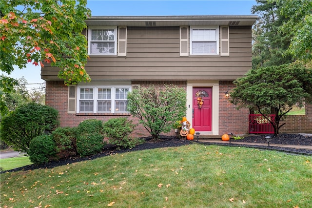 view of front of home featuring a front yard