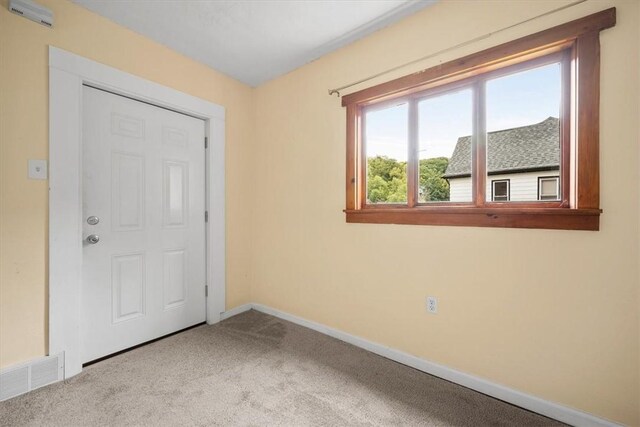 empty room with carpet flooring