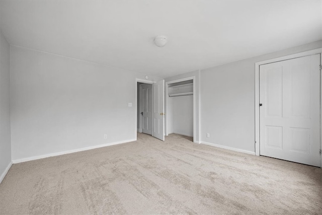 unfurnished bedroom with light colored carpet