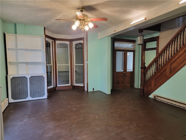 interior space featuring ceiling fan, a textured ceiling, dark hardwood / wood-style floors, and a baseboard radiator