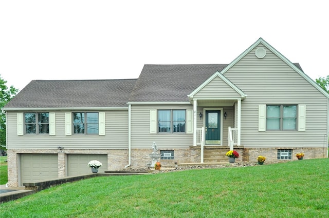 view of front of home with a garage and a front yard