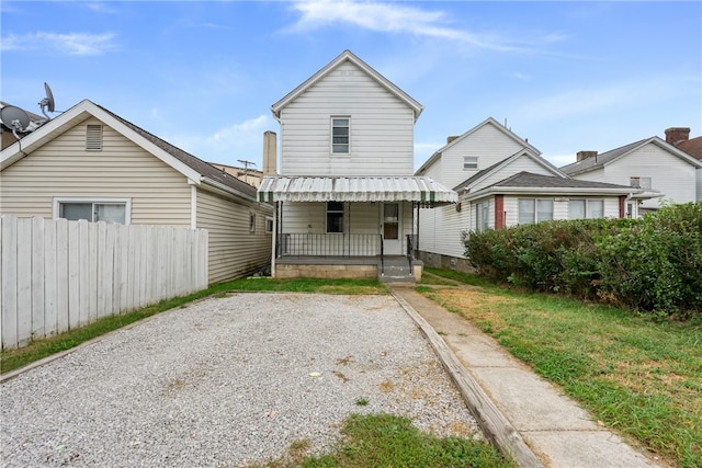 back of house with covered porch