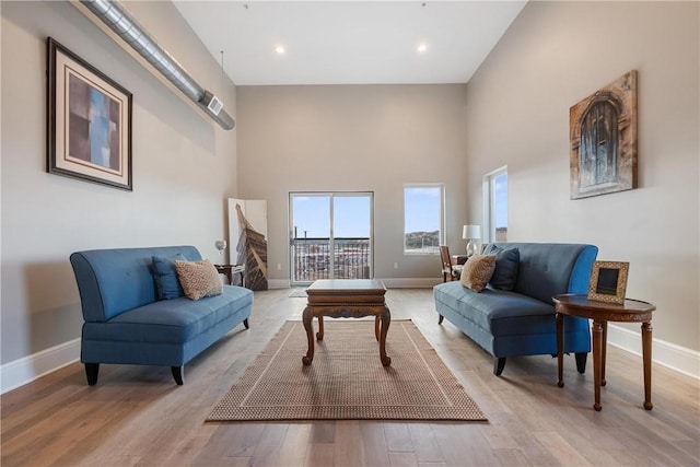 living area with light hardwood / wood-style flooring