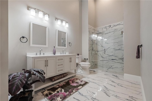 bathroom featuring vanity, toilet, and a tile shower