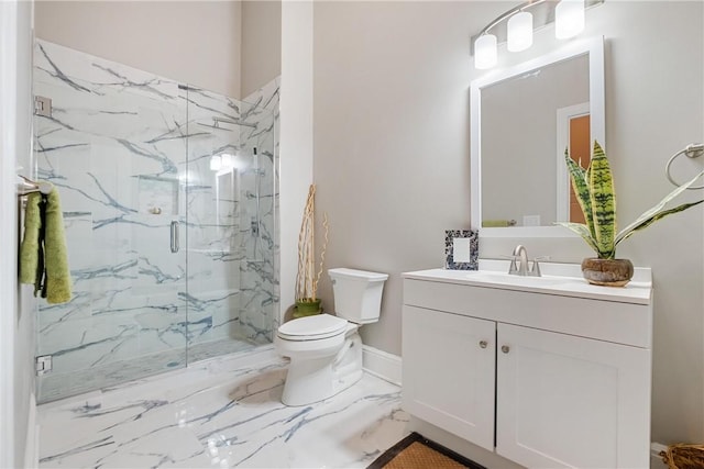 bathroom featuring vanity, toilet, and a shower with shower door