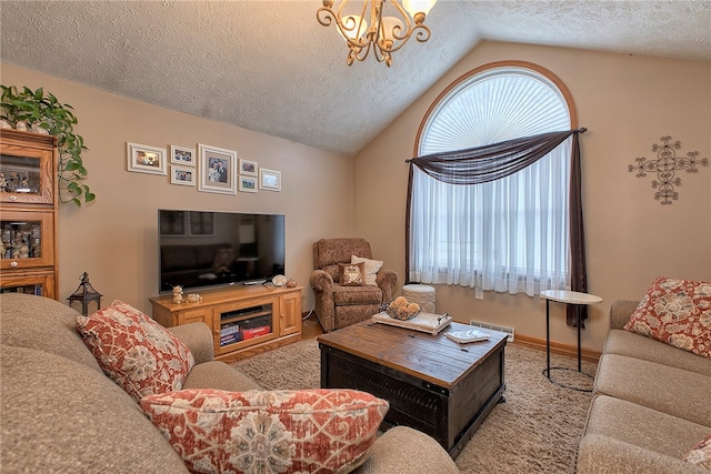 living room with lofted ceiling, a textured ceiling, light colored carpet, and a chandelier