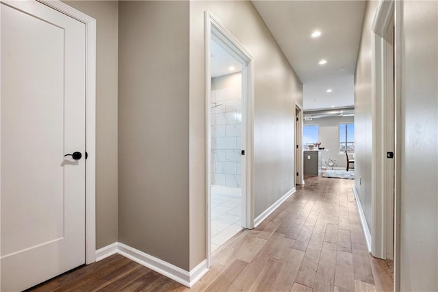 hall with light hardwood / wood-style flooring