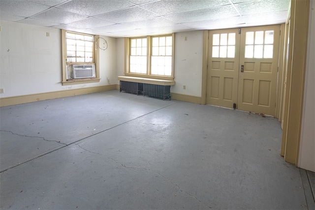 entrance foyer featuring cooling unit and a drop ceiling